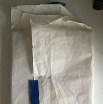 Two Framed Photos Wrapped in Tissue Paper